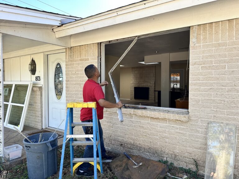 Installers installing window replacement in denton tx